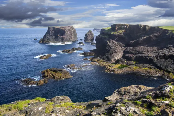 Sea stacks and sea cliffs at Eshaness / Esha Ness, Peninsula, Northmavine, Mainland, Shetland Islands, Scotland, UK, May. Digital composite