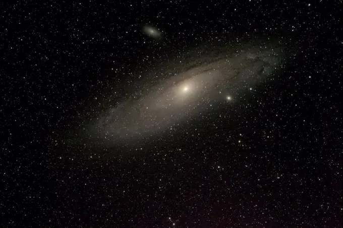 Andromeda galaxy and and sister galaxies M110 above and M32 below. Taken from eastern Colorado, USA, September 6-7 2013. Image taken with digital image stacking.