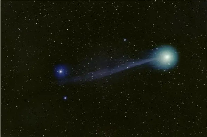 Comet Lovejoy (C/2014 Q2). The colours of the tail and comet head come from ionized carbon monoxide (CO+) and diatomic carbon (C2), which glow blue and green respectively in the near-vacuum of interplanetary space. Seen from east of Parker, Colorado, USA, 10th January 2015. Taken using digital focus stacking.