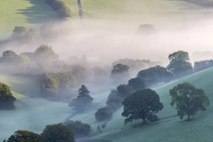 Misty morning view of Exmoor countryside from Winsford Hill, Exmoor National Park, Somerset, UK. October 2016.