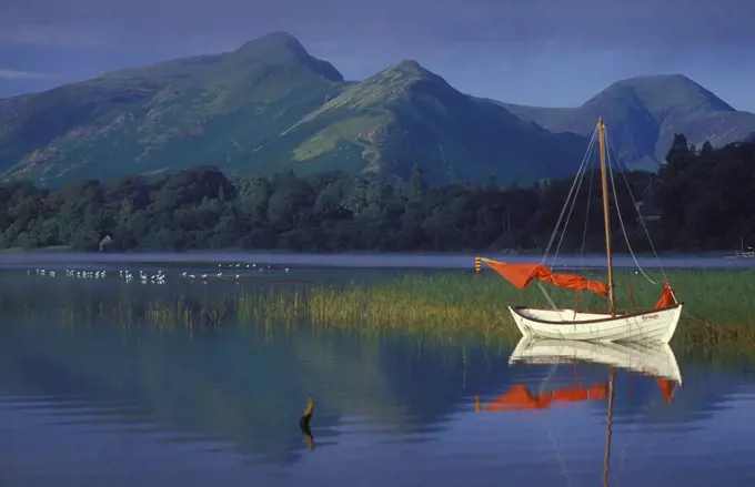 Boat with Red Sail, Derwent Water, Lake District National, Park, Cumbria, England. UK