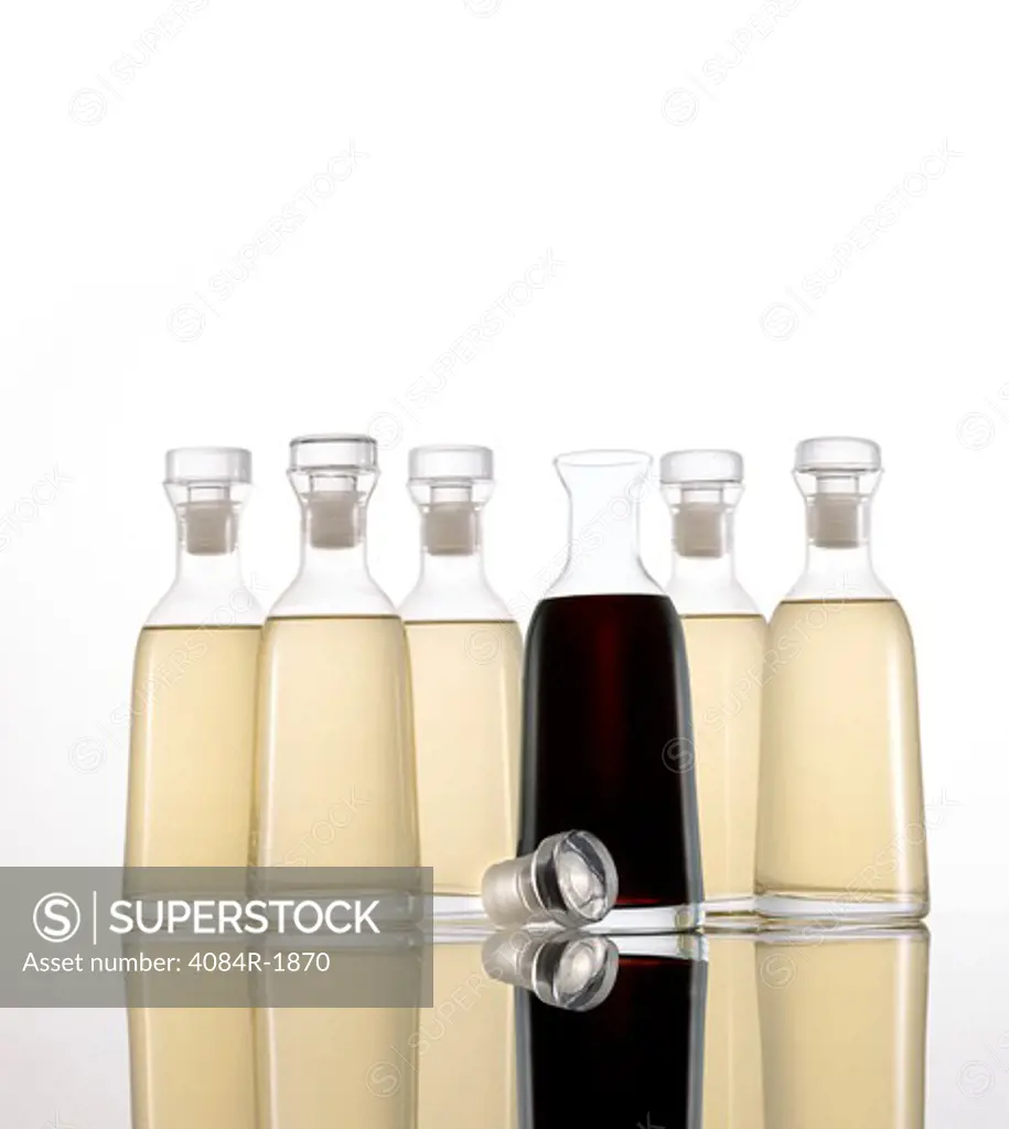 Bottled Light and Dark Vinegar on White Background