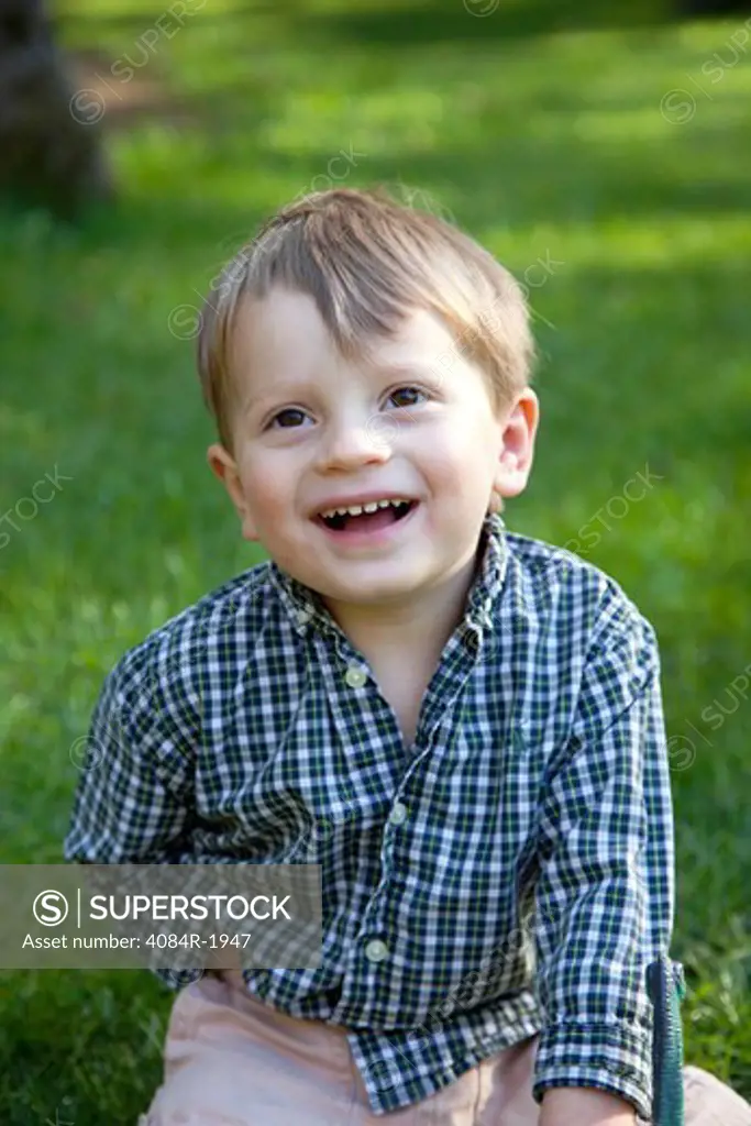 Smiling Young Boy Looking Up