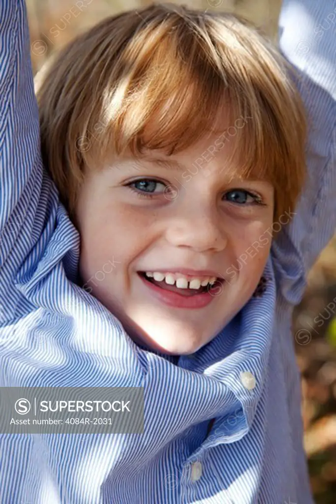 Smiling Boy With Arms Up, Close-Up