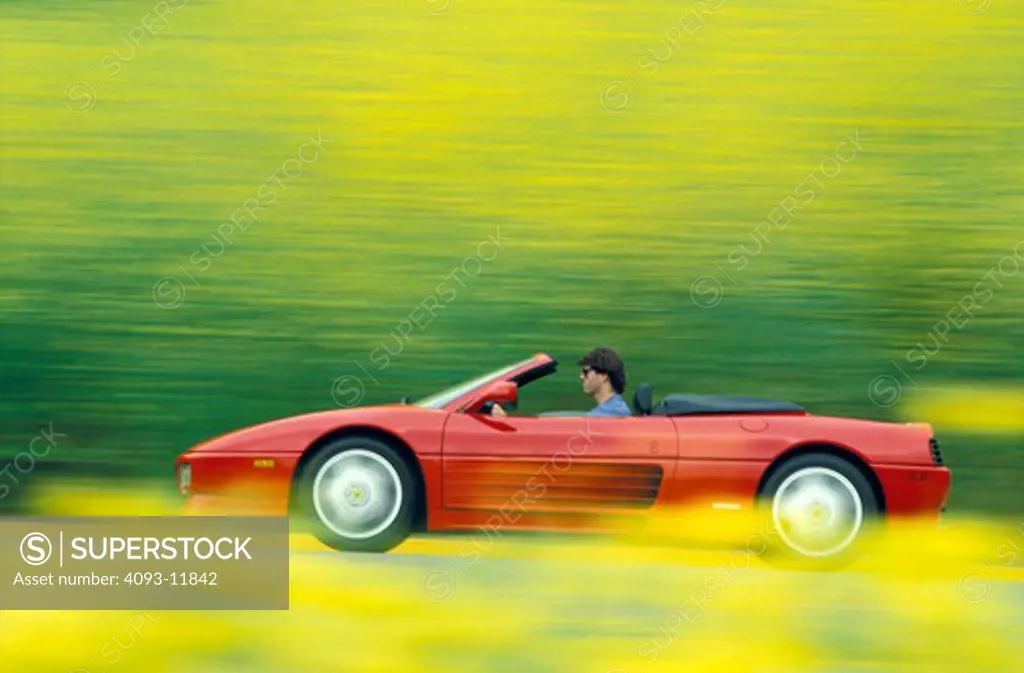 Ferrari 1993 348 Spider red profile blur flowers 1990s street