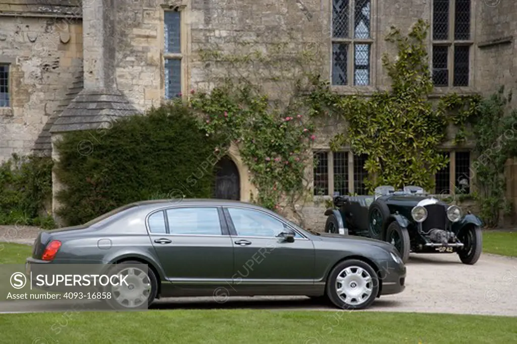 2007 Bentley Continental Flying Spur  Beneath the Flying Spur's dramatic sheetmetal, you'll find the latest developments in automotive technology. A W12 engine incorporates twin turbochargers to produce some 552 horsepower. All-wheel drive delivers excellent traction in all kinds of weather. A sophisticated suspension with air springs and electronically controlled dampers produces extraordinary driving composure. on  driveway in front of a very large house castle