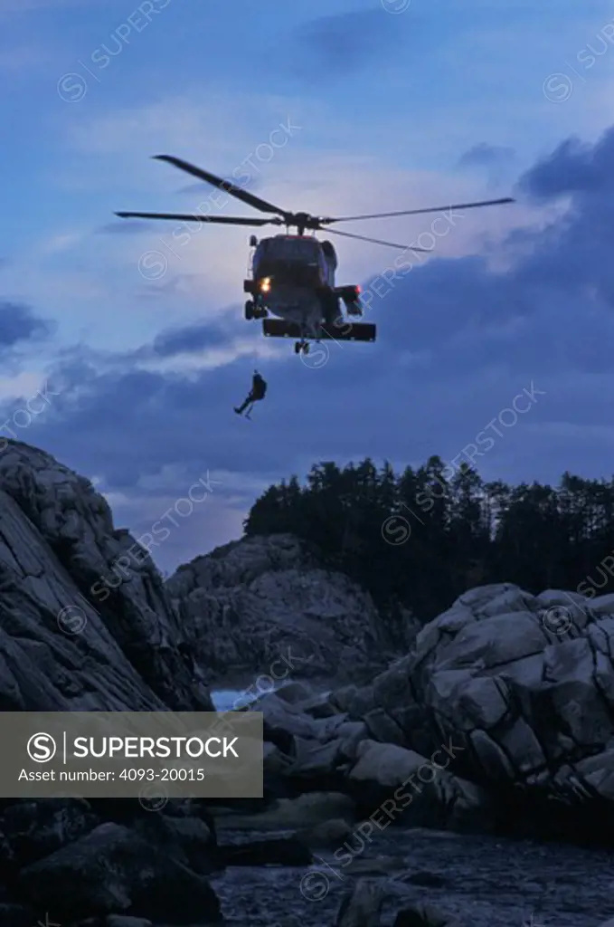 Sikorsky Military Helicopters Aviat HH-60J Jayhawk USCG U.S. Coast Guard rescue swimmer hoist