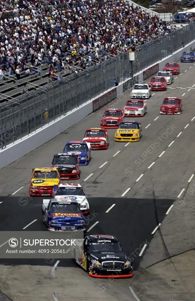 NASCAR Craftsman Truck Series stands cornering race car cars head on