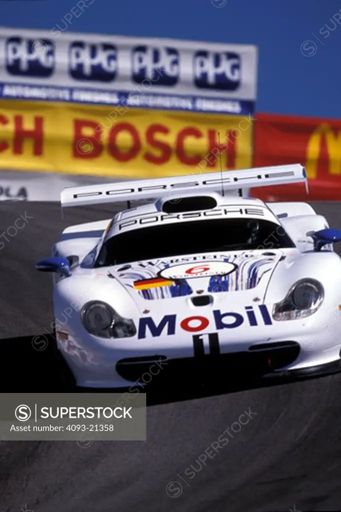 Porsche sports car racing Laguna Seca Corkscrew curve race car head on street