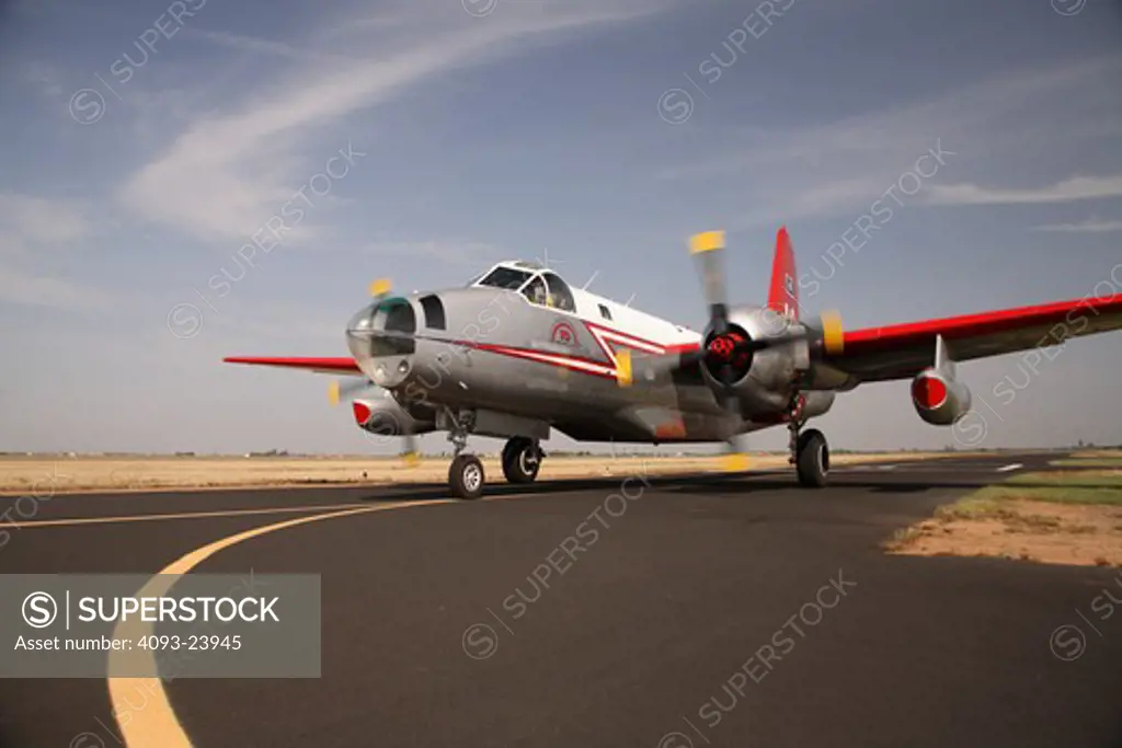 The Lockheed P-2 Neptune ( P2V ) was a Maritime patrol and ASW aircraft. It was developed for the United States Navy by Lockheed. They're now primarily used for fire fighting. This one is taxiing to the runway at Porterville, CA.