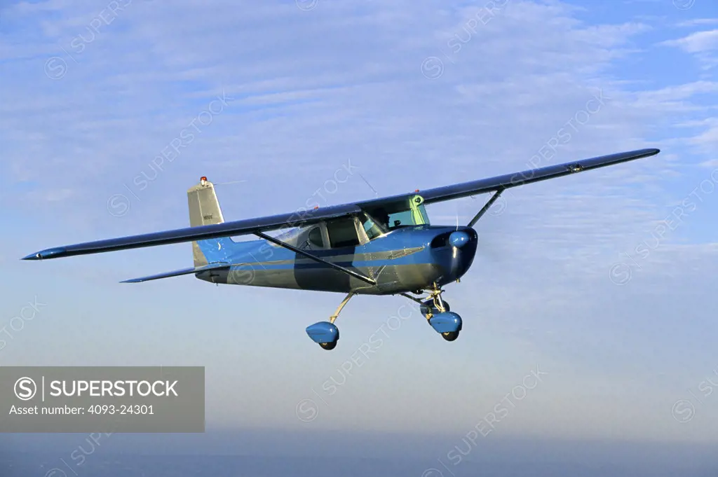 1959 Cessna C150 C 150 Fastback Straight Tail flying.