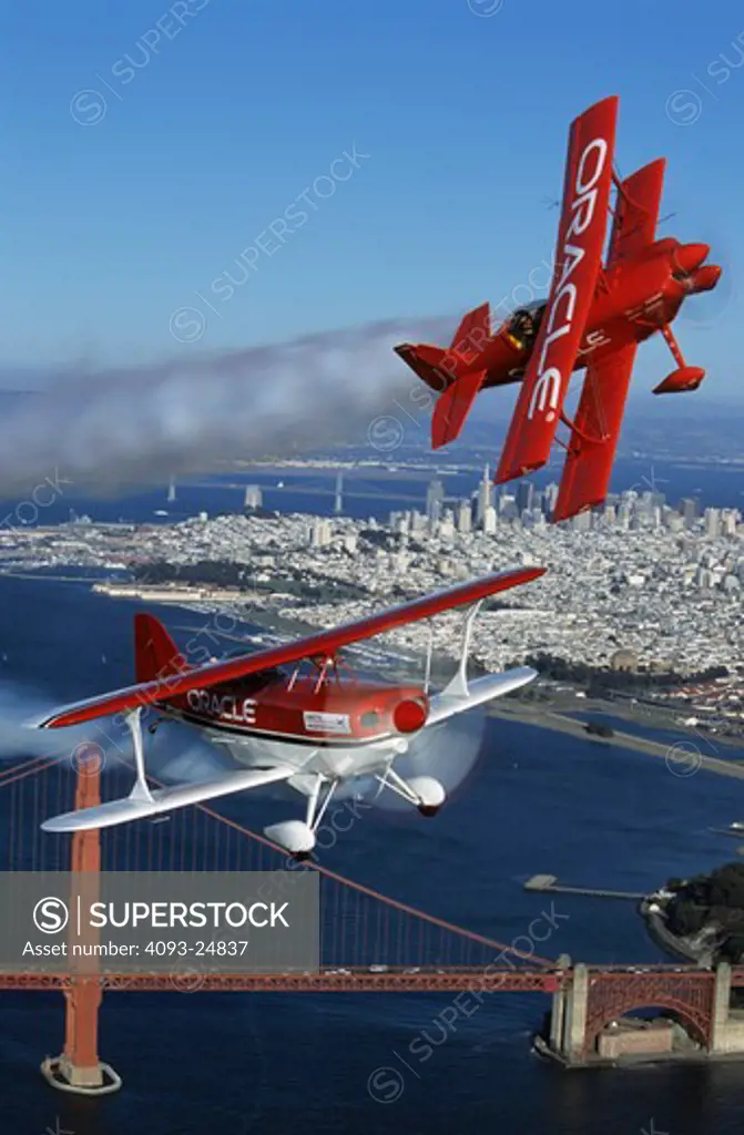 Sean Tucker in Oracle Challenger and Pitts S2 with the Golden Gate Bridge in the background.