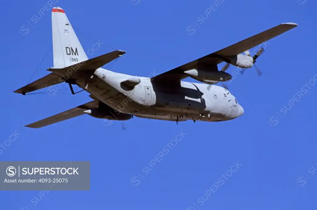 USAF Lockheed EC-130 Hercules electronic warfare aircraft on takeoff.