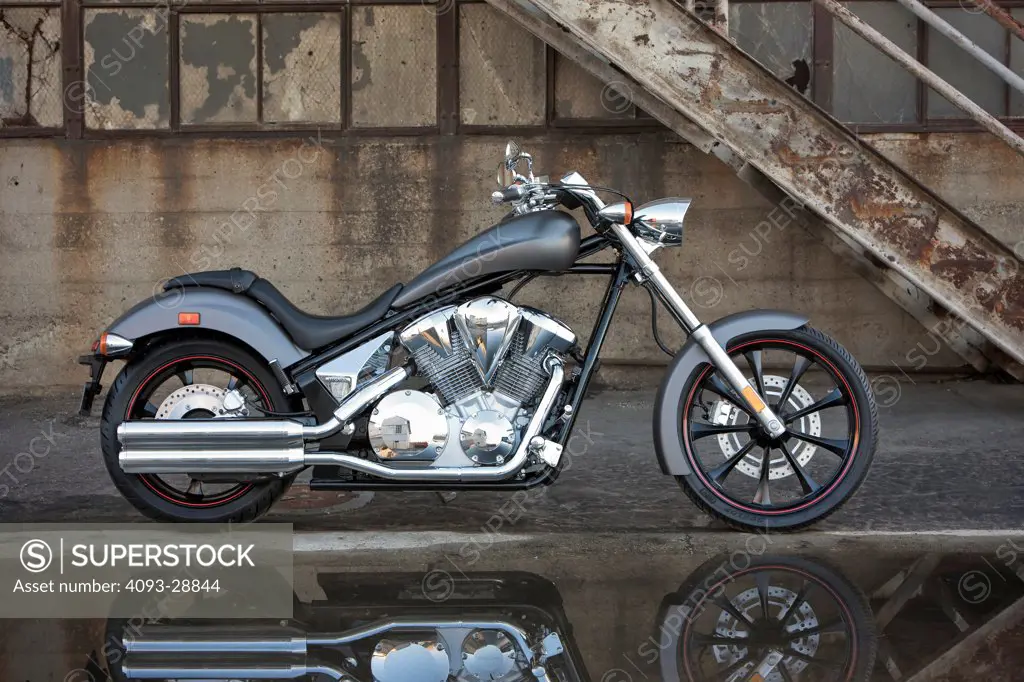 2009 Honda Fury parked outside of industrial building, side view, black and white