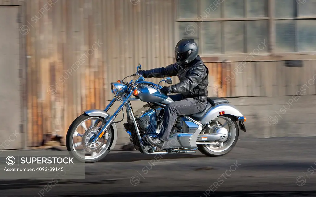 2009 Honda Fury in downtown dock area by large warehouse, side view