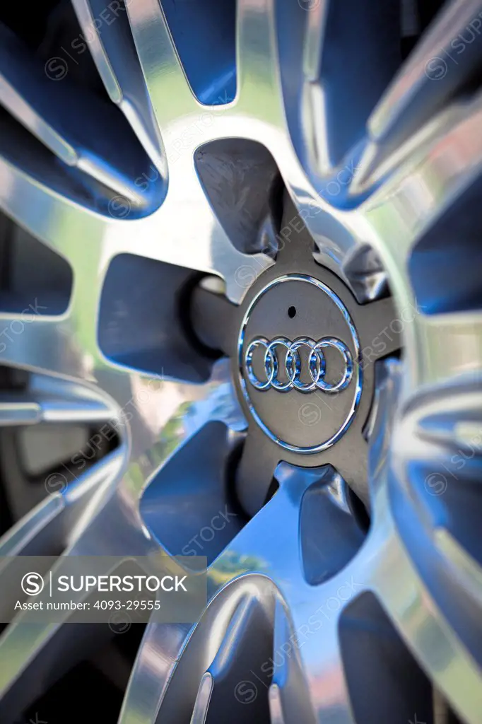 Exterior detail of a 2012 Audi A8 showing the badge logo on the wheel rim.