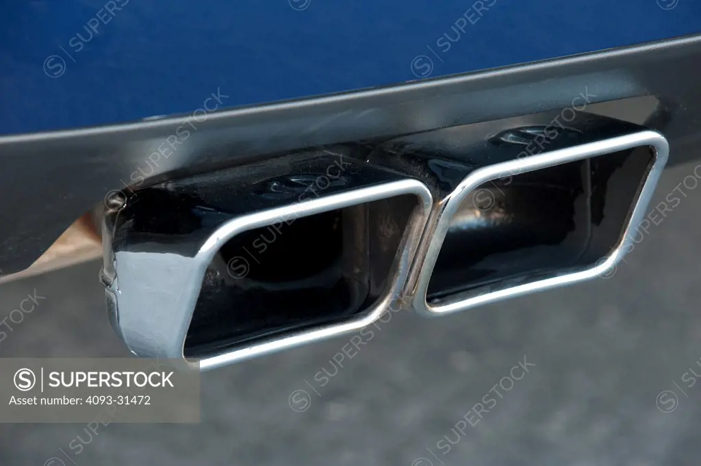 Detail of the rear exhaust pipes of a 2012 Dodge Challenger SRT8 392 Hemi