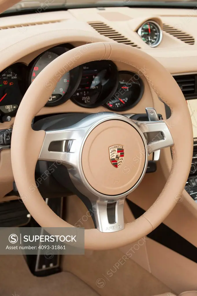 Interior of a 2012 Porsche 911 Carrera S. Porsche platform number 991 showing the dashboard, steering wheel and instrument cluster.