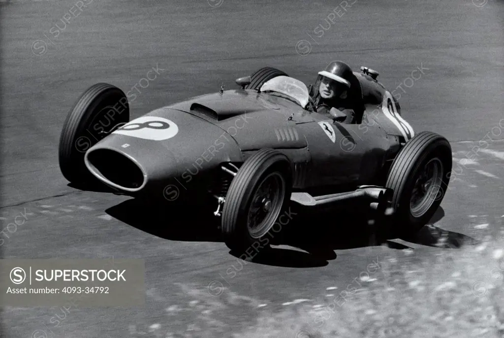 Mike Hawthorne in his Lancia-Ferrari D50 on his way to 2nd place in the historic battle with Fangio in the 1957 German Grand Prix.