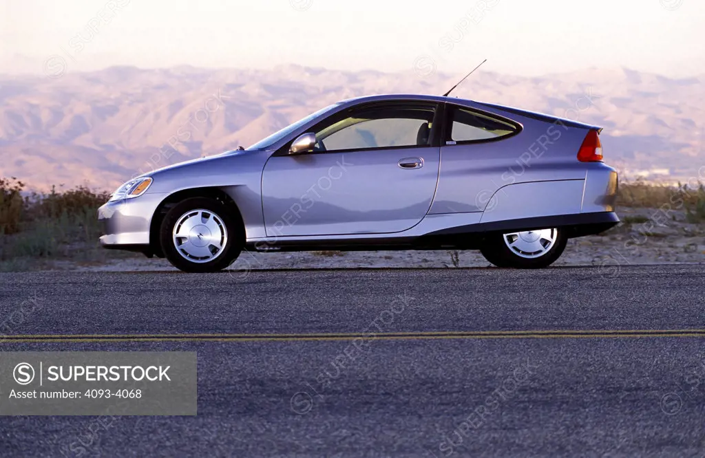 Hybrid Honda Insight 2001 silver shoulder street