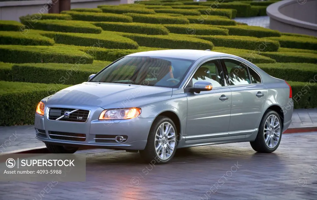 2008 Volvo S80 parked in front of a well groomed hedge