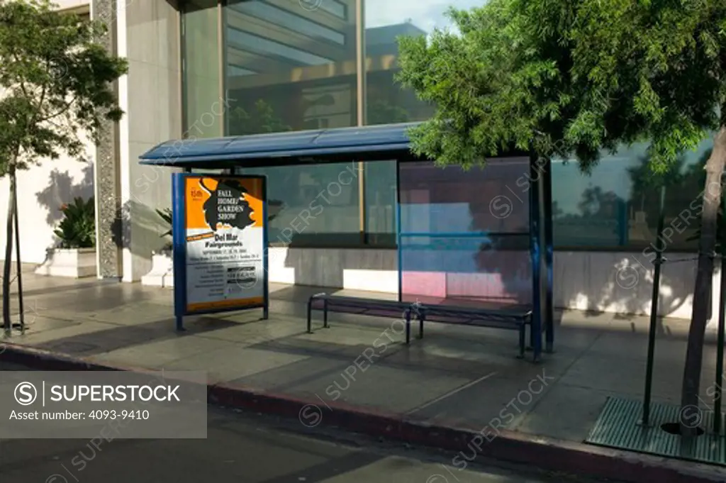 bus stop bus shelter advertisement sidewalk city