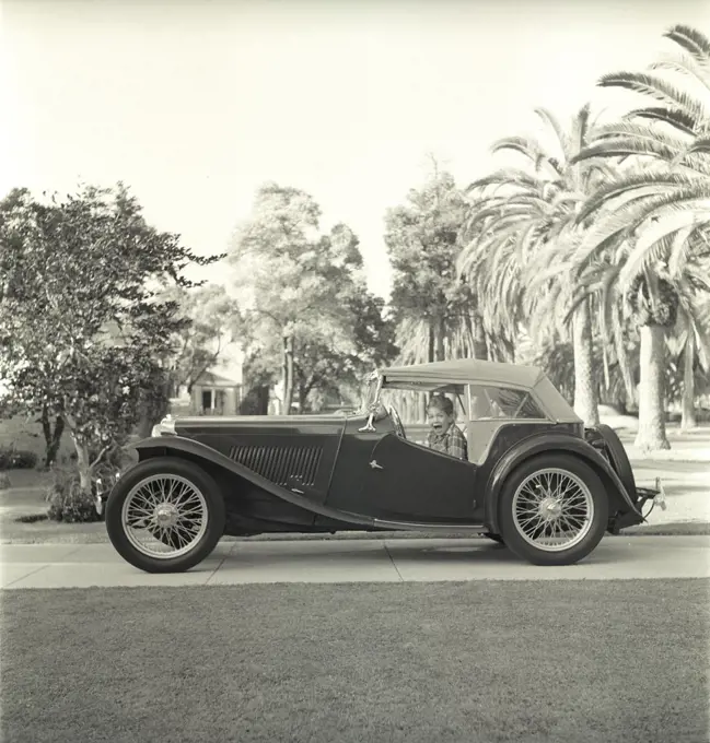 MG TC 1949 1940s boy kid driveway Los Angeles period nostalgia street city