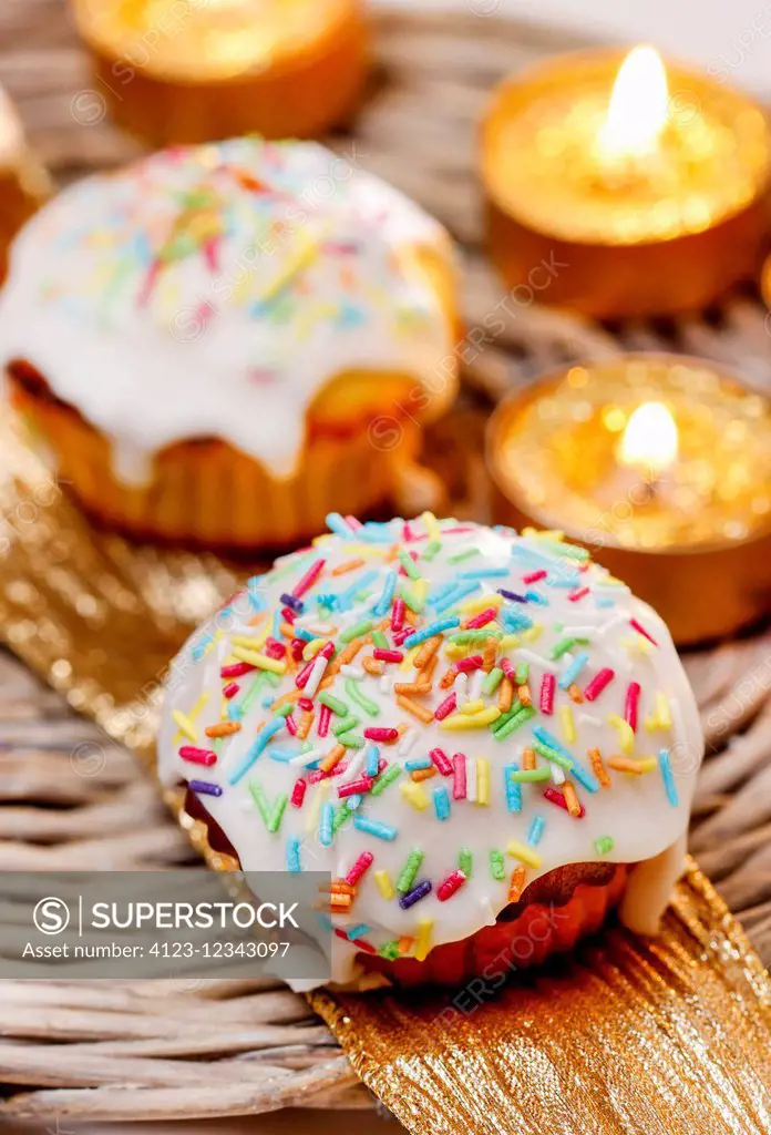 Festive muffins decorated with colorful sprinkles