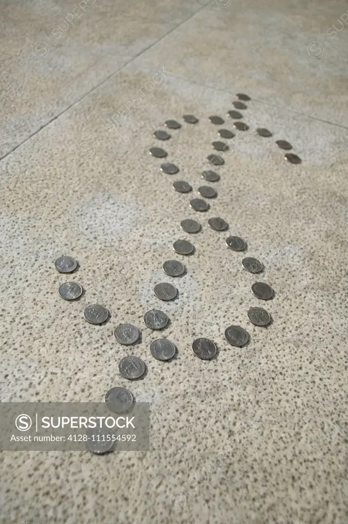 Quarter dollar coins in the shape of the dollar sign