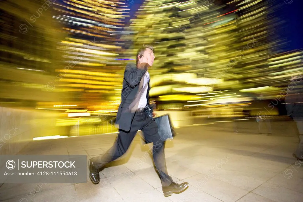 Businessman leaving the office at night