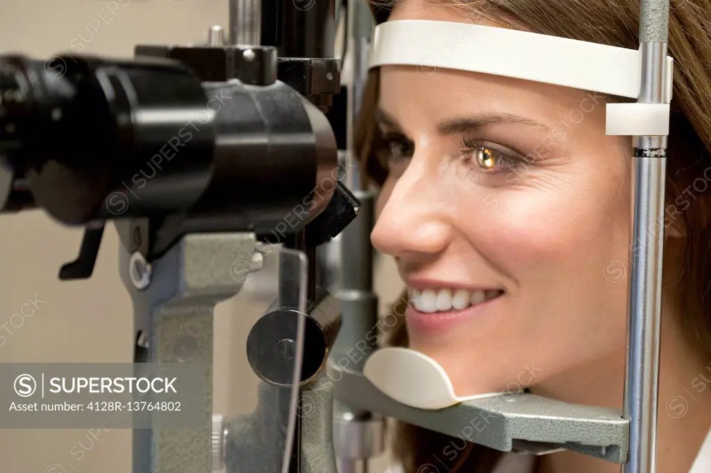 Mid adult woman having eye test.