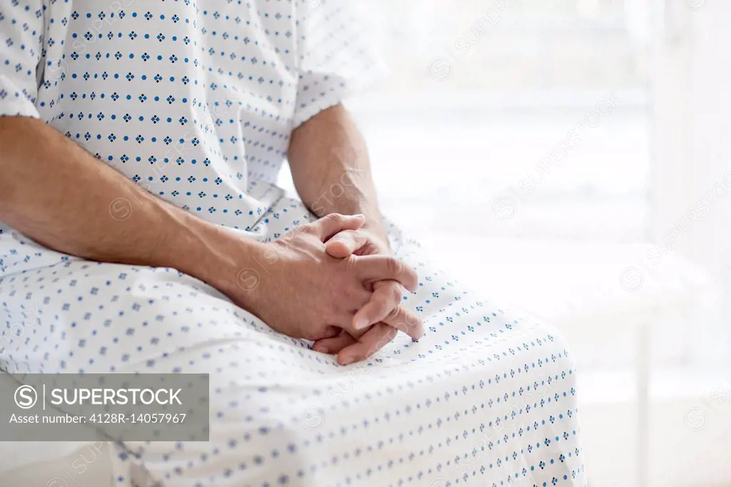 Male patient wearing hospital gown