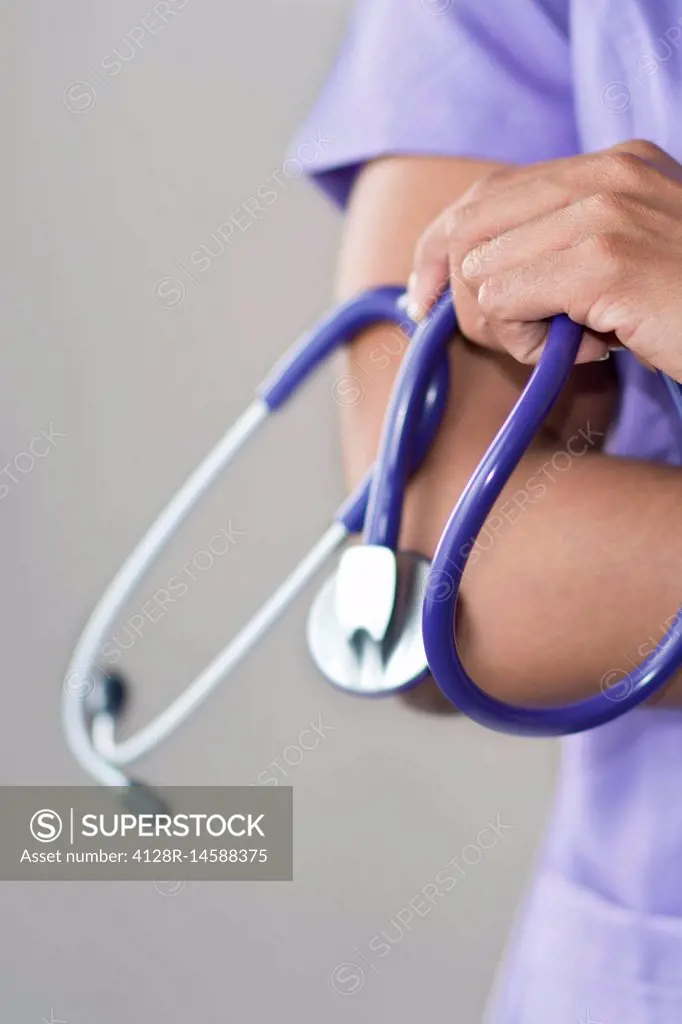 Female doctor holding stethoscope