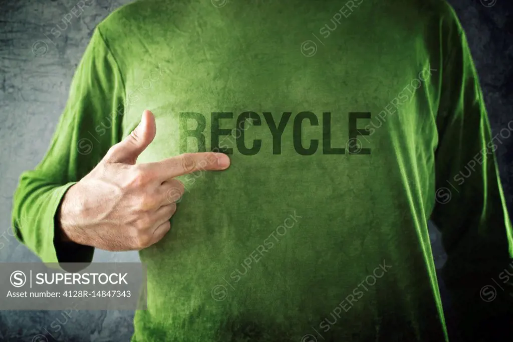 Man pointing to recycle printed on his shirt