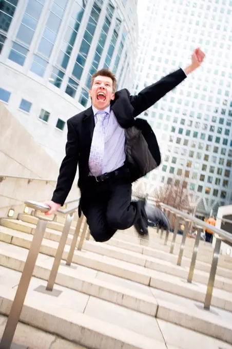 Businessman jumping for joy