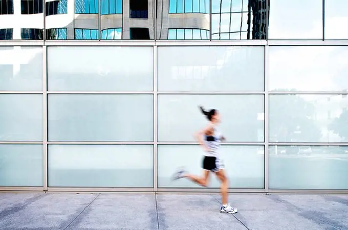 Female athlete in action, San Diego, California, USA