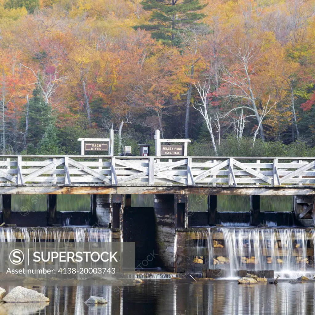 Crawford Notch State Park - Reflection of dam along the Saco River at the Willey House Historical Site in the White Mountains, New Hampshire USA during the autumn months