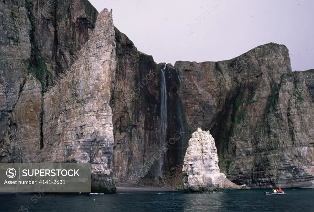 bear island, norway (bjornoya) remote island in arctic zodiac beneath sheer cliffs