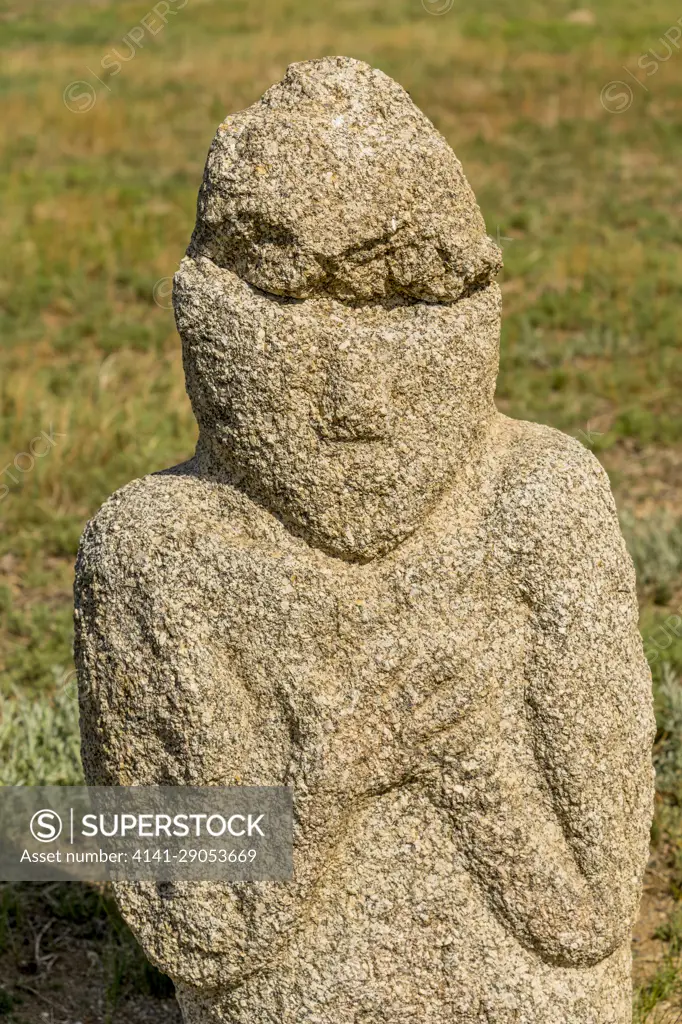 A stone figure of the Ungut complex, a Turkik monument ensemble consisting of man stones and numerous tombs from the 6-8th centuries AD, in Hustain Nuruu National Park, Mongolia.