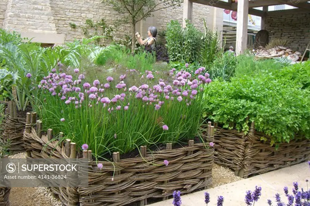 summer solstice, a show garden created by daylesford organic featuring green wheat with scarecrows and a potager or kitchen garden. chelsea rhs flower show, london, england 2008 date: 22.10.2008 ref: zb1159_122662_0061 compulsory credit: photos horticultural/photoshot 