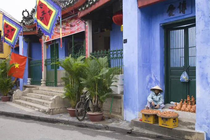 Vietnam, Hoi An,  street scene, flags, historic architecture,