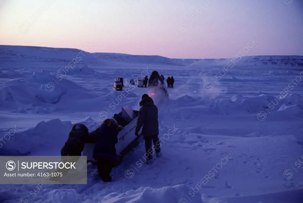 CANADA, NUNAVUT,  FROZEN BARROW STRAIT, TOURISTS ON SKIDOO EXPEDITION