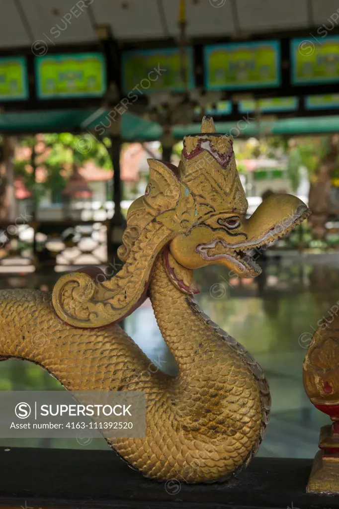 Detail of a naga statue on a fence of one of the pavilions at the Kraton of Yogyakarta (Keraton Ngayogyakarta Hadiningrat), the Sultans palace complex in Yogyakarta, Java, Indonesia.