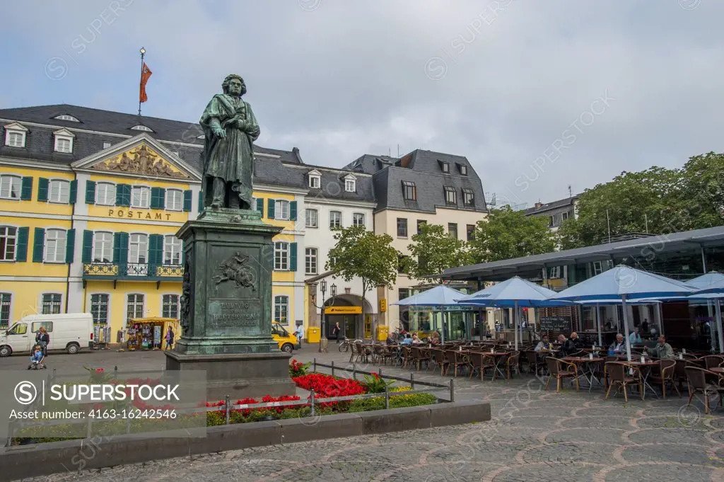 A statue of Ludwig van Beethoven standing on the Bonn Minster Square in Bonn, Germany.