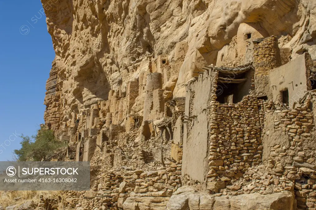 View of the Cliffside dwellings of the former Tellem tribe (13th century) at the Ireli Dogon village in the Bandiagara Escarpment in the Dogon country in Mali, West Africa.