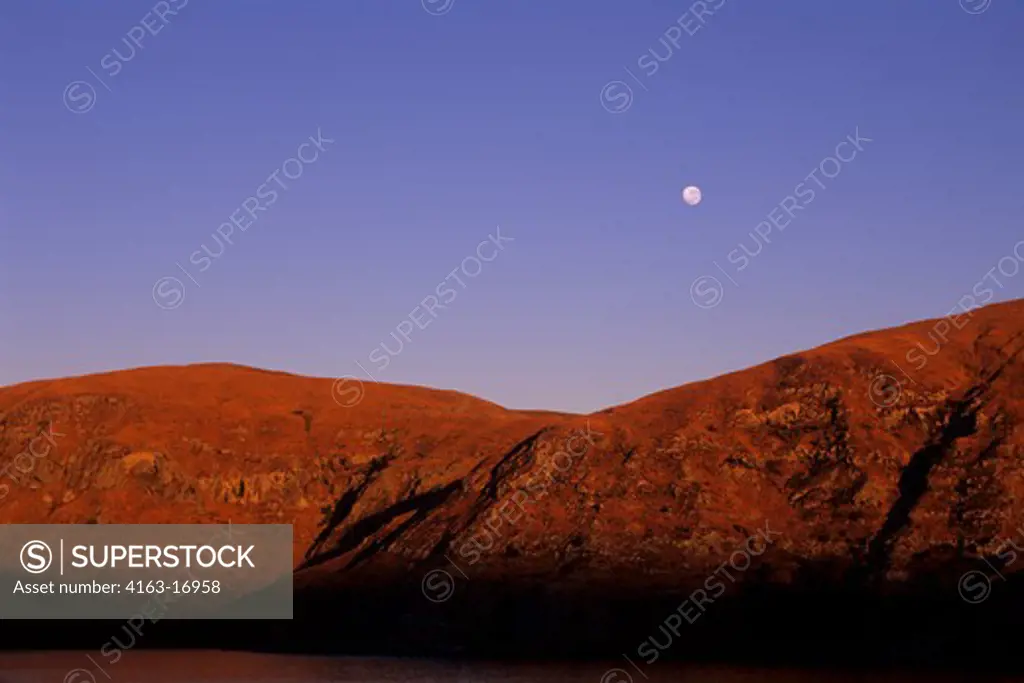 NEW ZEALAND, SOUTH ISLAND, NEAR CHRISTCHURCH, LYTTELTON BAY ENTRANCE, MOON AT SUNRISE