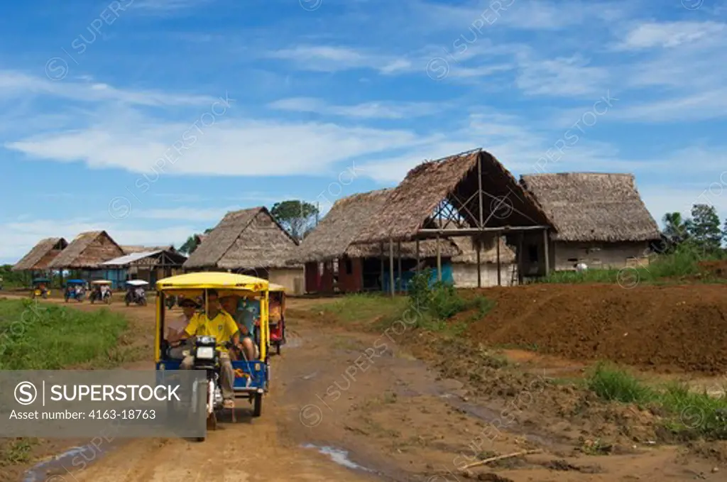 PERU, AMAZON RIVER BASIN, NEAR IQUITOS, MARANON RIVER, TOWN OF NAUTA, STREET SCENE, TOURISTS RIDING IN MOTORBIKE TAXI