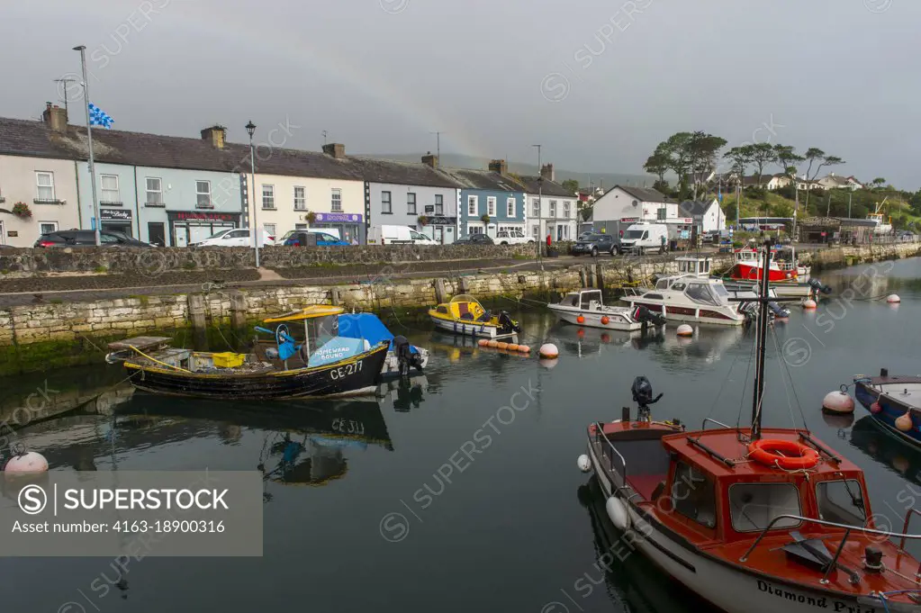 Fishing boats in the small fishing harbor of Carnlough, along the Causeway Coastal Route in Northern Ireland.