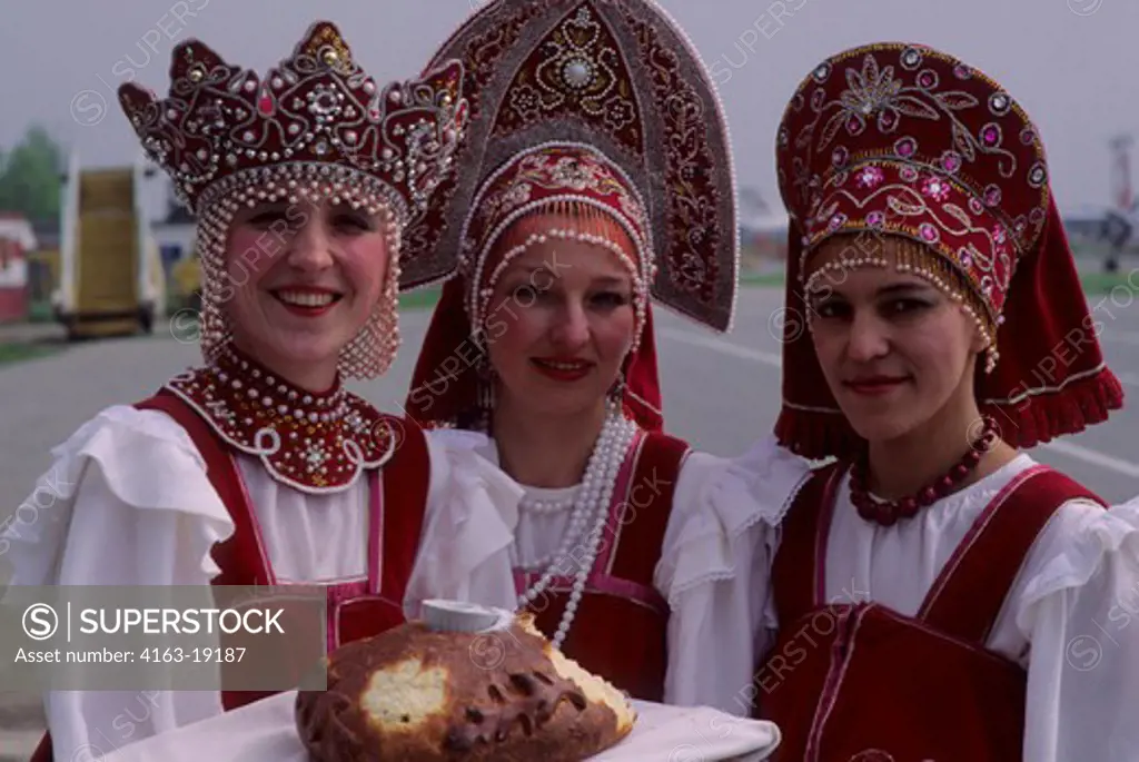 RUSSIA, SAKHALIN,AIRPORT, TRADITIONAL WELCOME CEREMONY, WOMEN OFFERING BREAD AND SALT