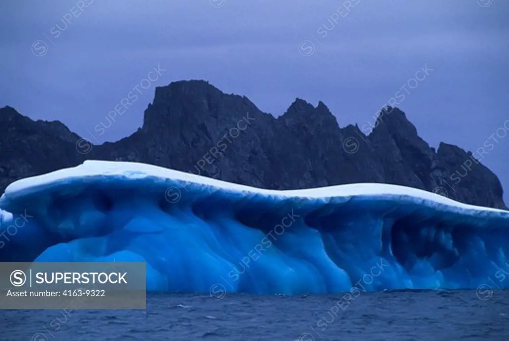 ANTARCTICA, NEAR ELEPHANT ISLAND, MARBLED BLUE ICEBERG..